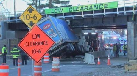 A truck after it became wedged underneath the East Street Railroad Bridge in Westwood Friday morning.
